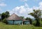 Colourful green painted Zulu mud huts / rondavels in rural Mpumalanga, South Africa