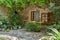 Colourful Green Patio With Ancient Stone Walls