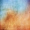 Colourful grunge background in shades of orange and blue