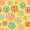 Colourful hand drawn circular paint dots in scattered design. Seamless vector pattern on yellow background. Abstract