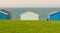 Colourful holiday wooden beach huts facing the calm ocean