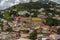 Colourful houses and a church line a hill in St Georges in Grenada