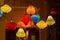 Colourful illuminated silk lanterns hanging outside a home