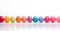 Colourful illustration of single coloured Easter eggs.