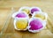 Colourful Japanese Mochi in a transparent plate.