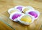 Colourful Japanese Mochi in a transparent plate.