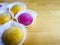 Colourful Japanese Mochi in a transparent plate.