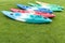 Colourful kayak on green grass