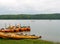 Colourful kayaks and rafts moored on sandy harbor of Phillipe Lake Quebec