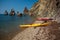 Colourful kayaks on sandy Es Figueral beach, Ibiza island, Spain