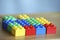 Colourful lego bricks on wooden background