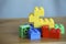 Colourful lego bricks on wooden background