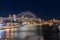 Colourful Light show at night on Sydney Harbour NSW Australia. The bridge illuminated with lasers and neon coloured lights