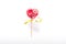 Colourful lollipop in the shape of a heart isolated on white background, a festive treat, a gift favorite, original declaration of
