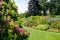 Colourful mature garden influenced by the naturalistic planting ethos, at Bressingham Gardens, Diss, Norfolk UK