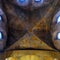 Colourful medieval painting on the ceiling of the main nave in Braunschweig Cathedral, with the peaceful sheep of Jesus in the