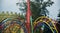 Colourful metallic parts of a whirligigs in a park