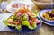 Colourful Moroccan vegetable salad and olive on dining table