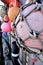 Colourful old fishing floats and buoys strung along a boatyard wall