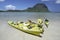 Colourful paddle boats in clear shallow water