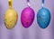 Colourful panted plastic easter eggs with sparkling dots