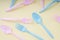 Colourful pastel utensil spoon and fork over bright yellow background