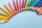 Colourful pencils laid out diagonal rainbow