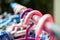 Colourful plastic clothes hang on stainless steel clothes rack, Close up shot, Selective focus, Light & Shadow, Laundry work