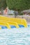 Colourful plastic slides in aquapark in the sunset. sliders, water park. vertical photo