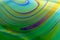 Colourful psychedelic soap bubble refractions pattern macro.