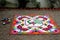 Colourful Rangoli Traditional Floral Design made with Dry Powdered Colours with Peacock, Flowers and Butterflies