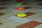 Colourful round shape objects on tiles surface