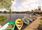 Colourful rowing boats for hire at the Meare. Thorpeness. UK