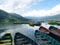 Colourful rowing boats on Phewa Lake, Pokhara, Nepal with mountains