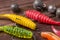 Colourful rubber fishing baits with plummets, close-up on wooden table. Selective focus