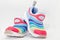 Colourful running shoes on white background