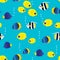 Colourful seamless pattern with cartoon coral reef vivid fish on blue background. Underwater life wallpaper.