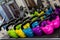 Colourful set of Kettlebells sitting on a rack