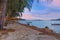 Colourful Skies Sunset over Rawai Beach in Phuket island Thailand. Lovely turquoise blue waters, lush green mountains