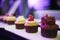 Colourful small cup cake dessert food table setting