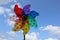 Colourful spotted and stripe garden windmills in springtime