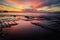 Colourful sunrise reflections from Tasmania's Tessellated Pavement