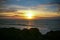 Colourful sunset over the sea at Punakaiki Pancake Rocks and Blowholes, New Zealand