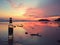 Colourful sunset reflecting in low tide puddles on the beautiful beach in Krabi Island, Thailand.