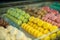 Colourful tasty macaroons in a row in the sweet shop