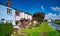 The colourful terrace of New Lane Cottages next to the Leeds to Liverpool Canal in Burscough, Lancashire, UK