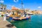 Colourful traditional Greek fishing boats in port of Lixouri town, Kefalonia island, Greece