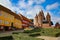 Colourful traditional houses along the road with the Church of Our Lady in the background, Kalundborg, Denmark.