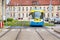 Colourful tram runs on tramway track over green grass area in Kosice SLOVAKIA