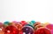 Colourful translucent glass Christmas baubles in whte isolated b